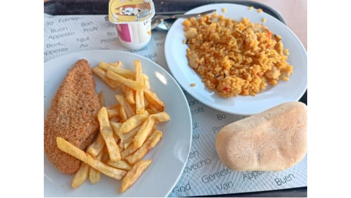 Typical cafeteria lunches — paella, seafood rice, fish, meat, always with bread and dessert